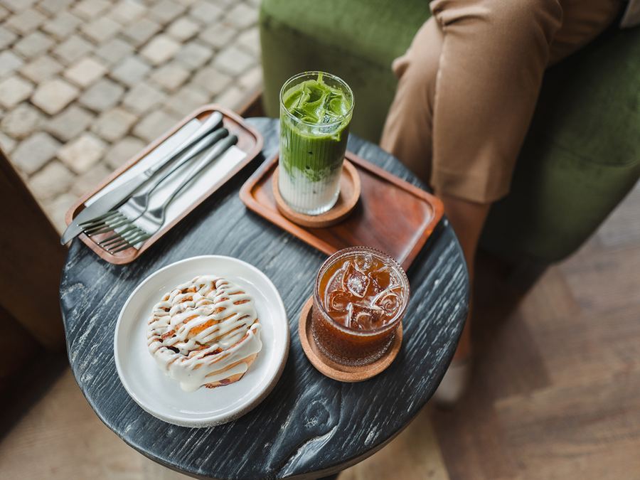 iced drinks and a pastry on a table at Honey’s