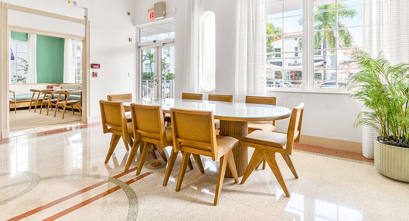 a dining table in the bright guest lounge